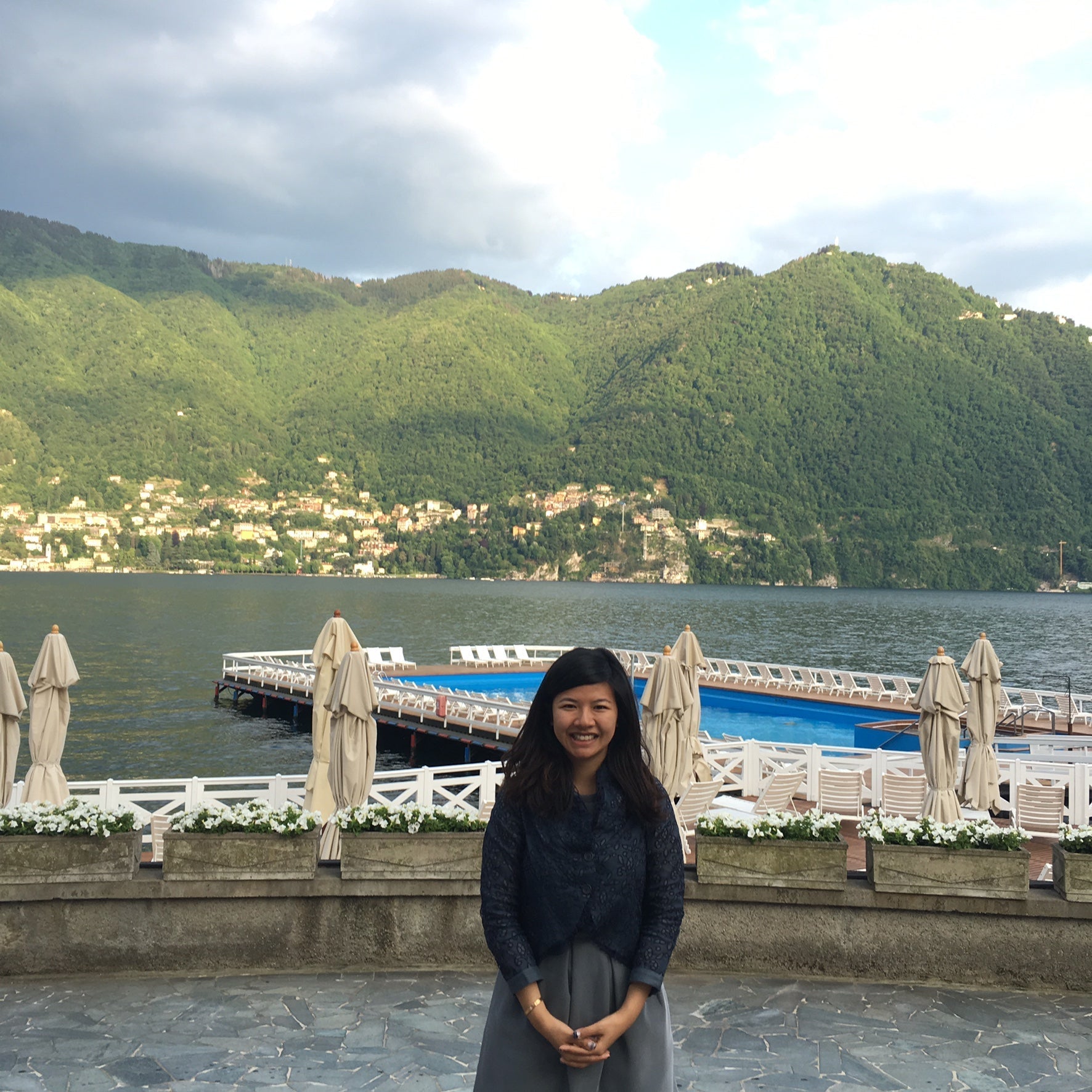 Artist Kirby stands in front of a harbour
