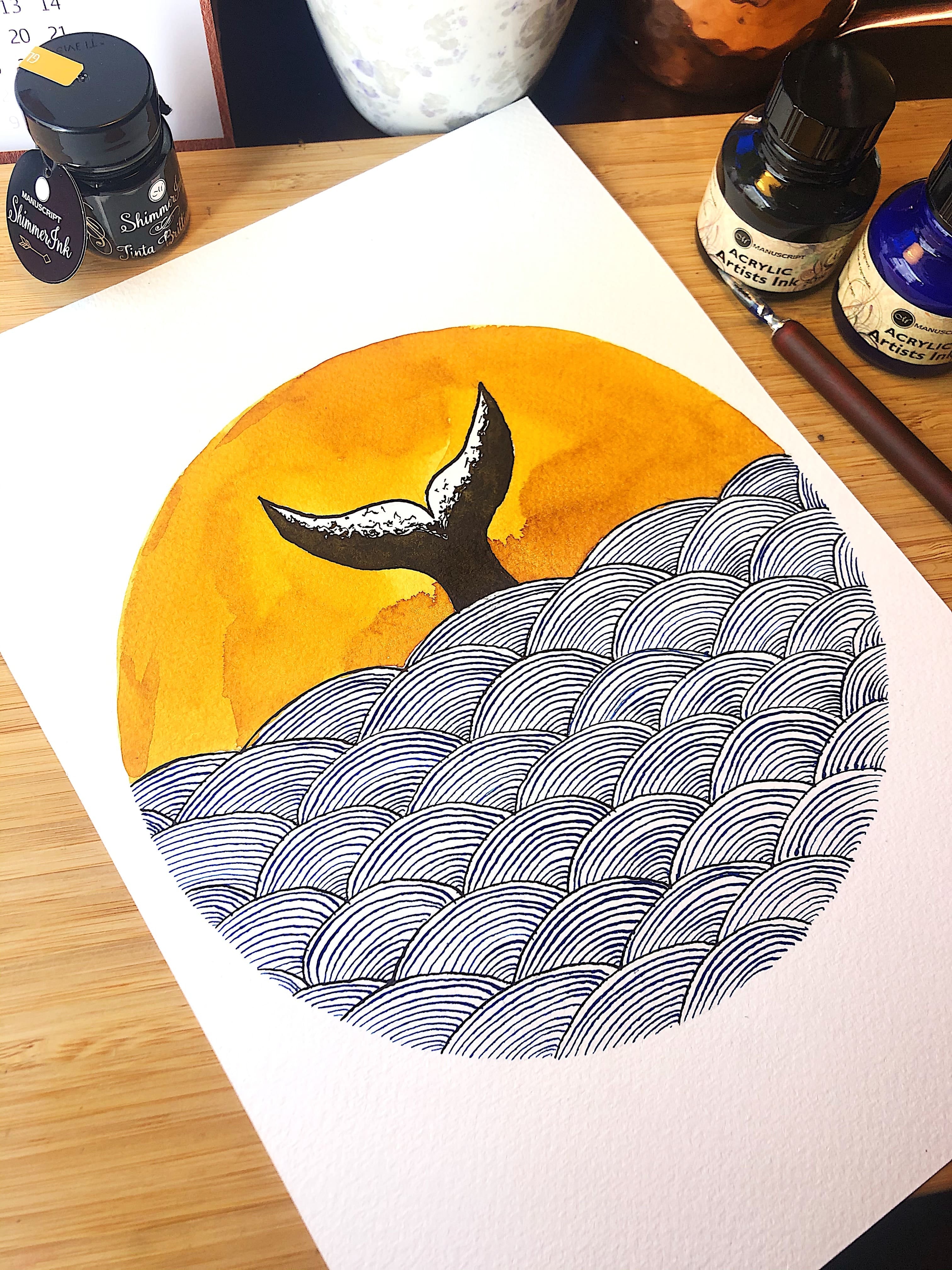 A circular artwork of a whale tail in the ocean drawn with a dip nib and inks